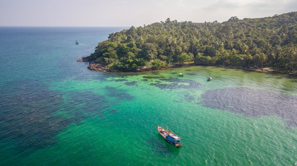 Hon Lon features coconut forests, calm beaches, and a tall lighthouse